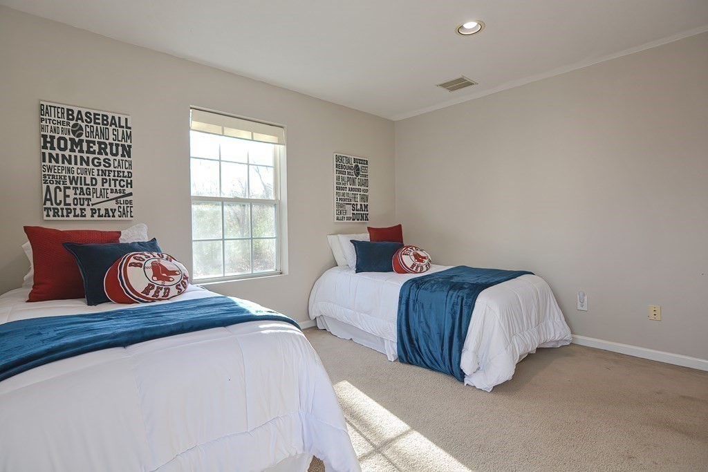 14 Robbins Road Foxboro, MA 02035 - Photo 24 of 42 a bedroom with a bed and a large window