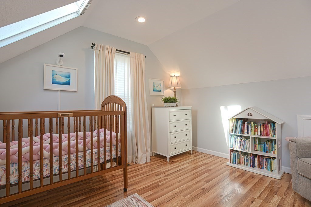 14 Robbins Road Foxboro, MA 02035 - Photo 28 of 42 a bedroom with a bed and a book shelf