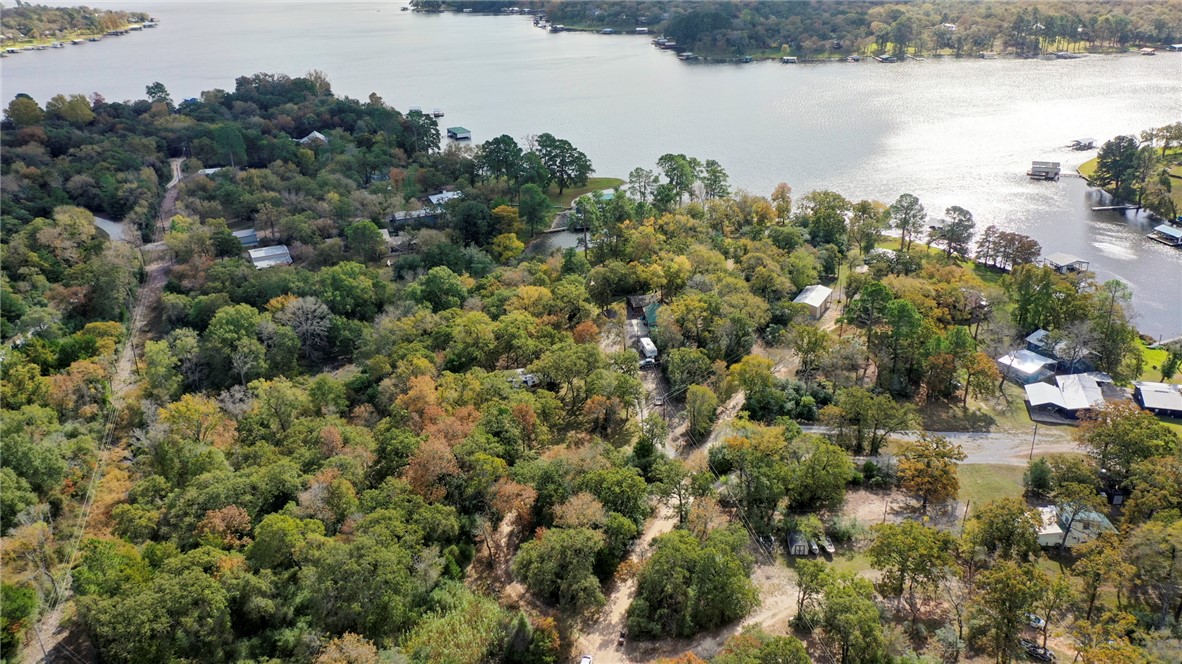 10232 Riley Green Road Franklin, TX 77856 - Photo 31 of 40 Drone / aerial view of a large body of water and a heavily wooded area
