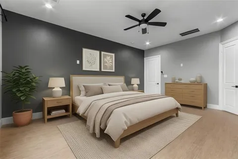 a bedroom with bed and a chandelier