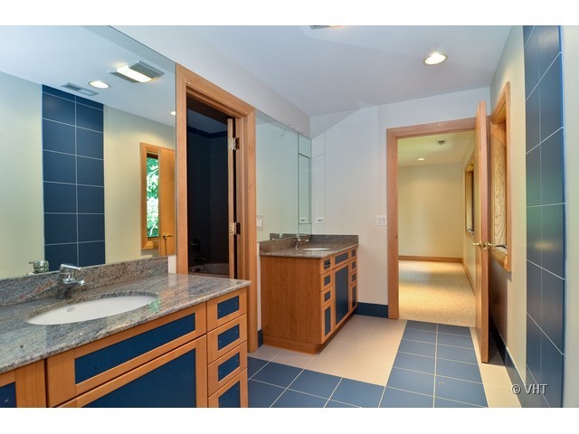 115 Dickens Road Northfield, IL 60093 - Photo 17 of 25 a kitchen with a sink a counter top space and stainless steel appliances