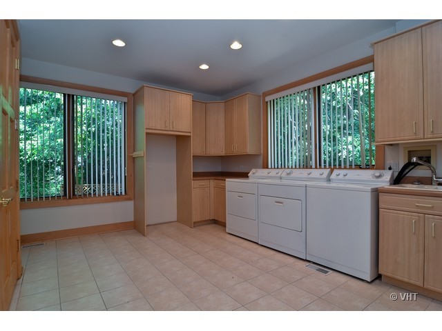 115 Dickens Road Northfield, IL 60093 - Photo 19 of 25 a kitchen with a refrigerator and window