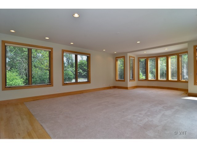 115 Dickens Road Northfield, IL 60093 - Photo 9 of 25 a view of an empty room with a window