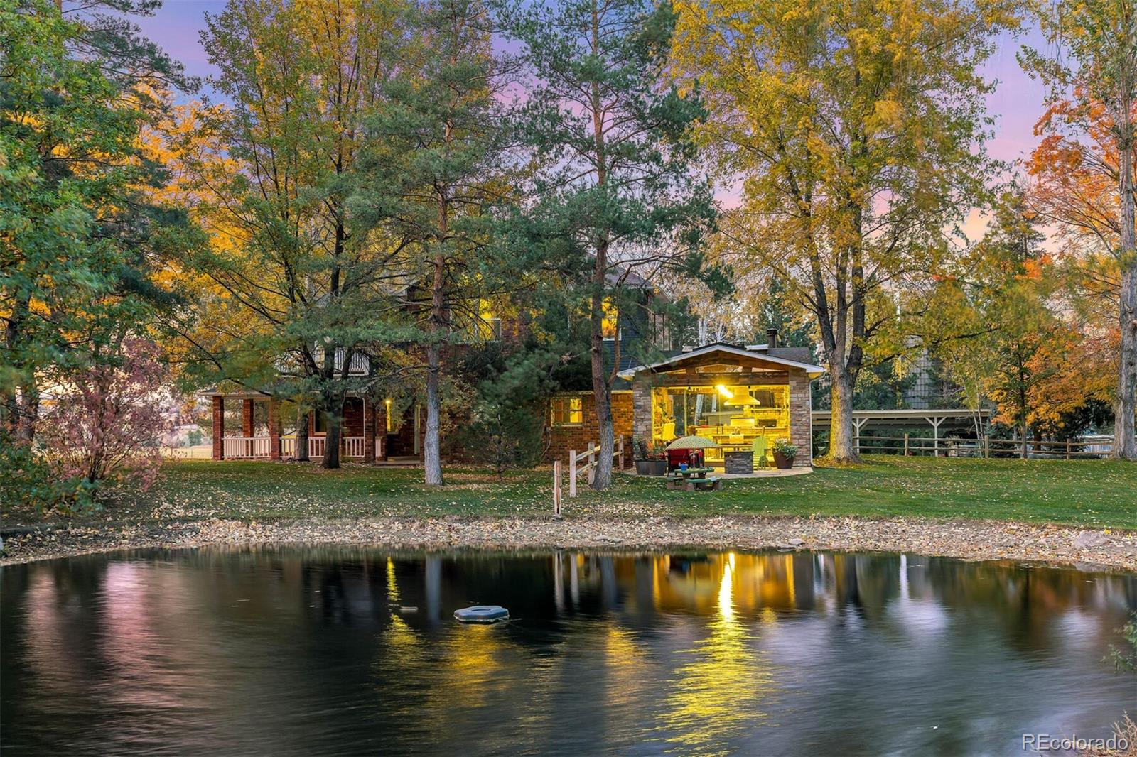 9905 Isabelle Road Lafayette, CO 80026 - Photo 11 of 38 a view of a lake with a house in the background