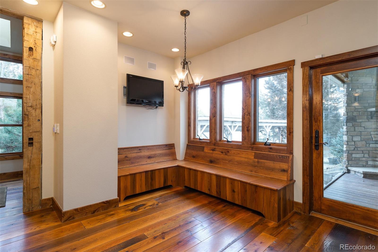 9905 Isabelle Road Lafayette, CO 80026 - Photo 17 of 38 a view of an empty room with wooden floor and a window