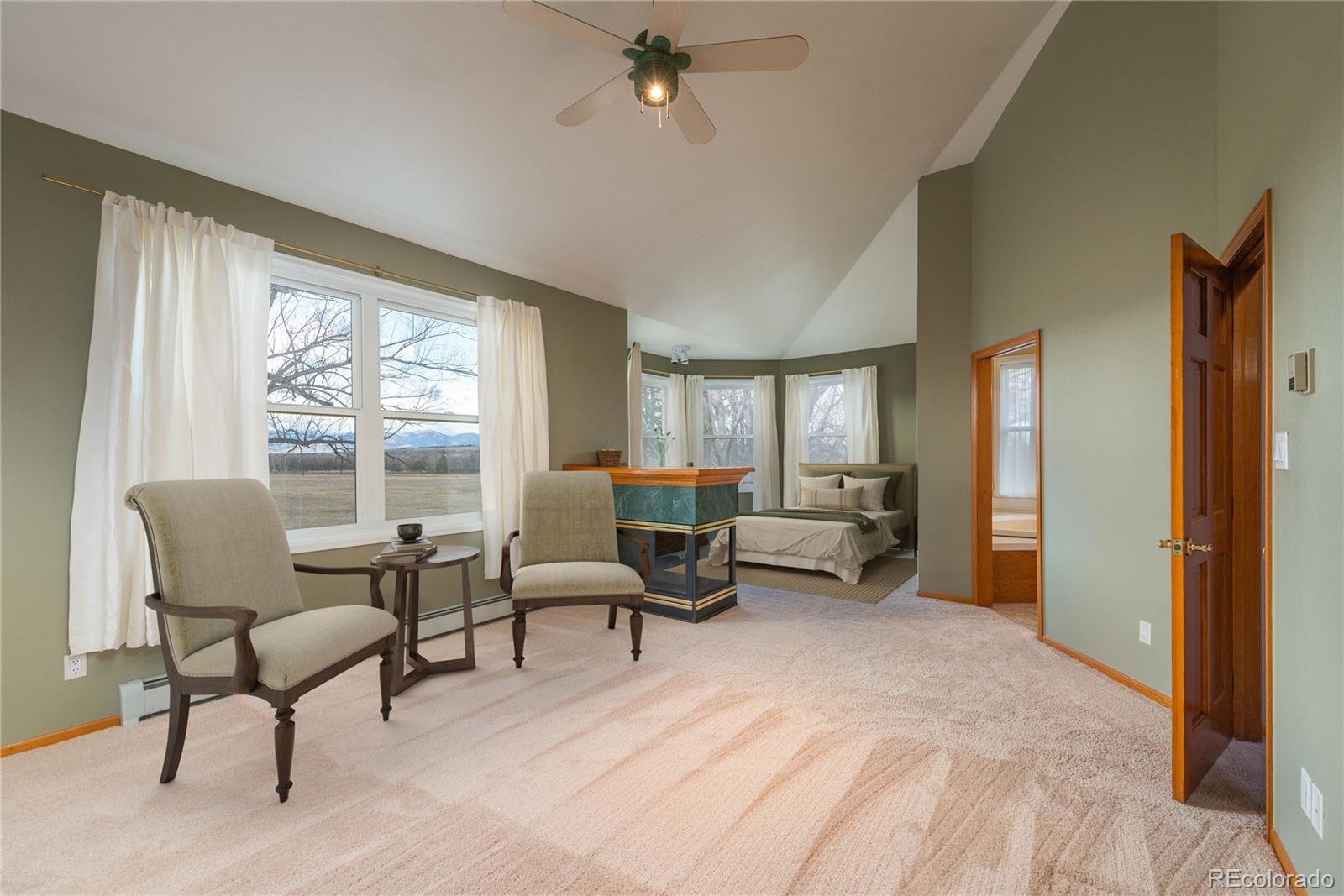 9905 Isabelle Road Lafayette, CO 80026 - Photo 33 of 38 a living room with furniture and a window