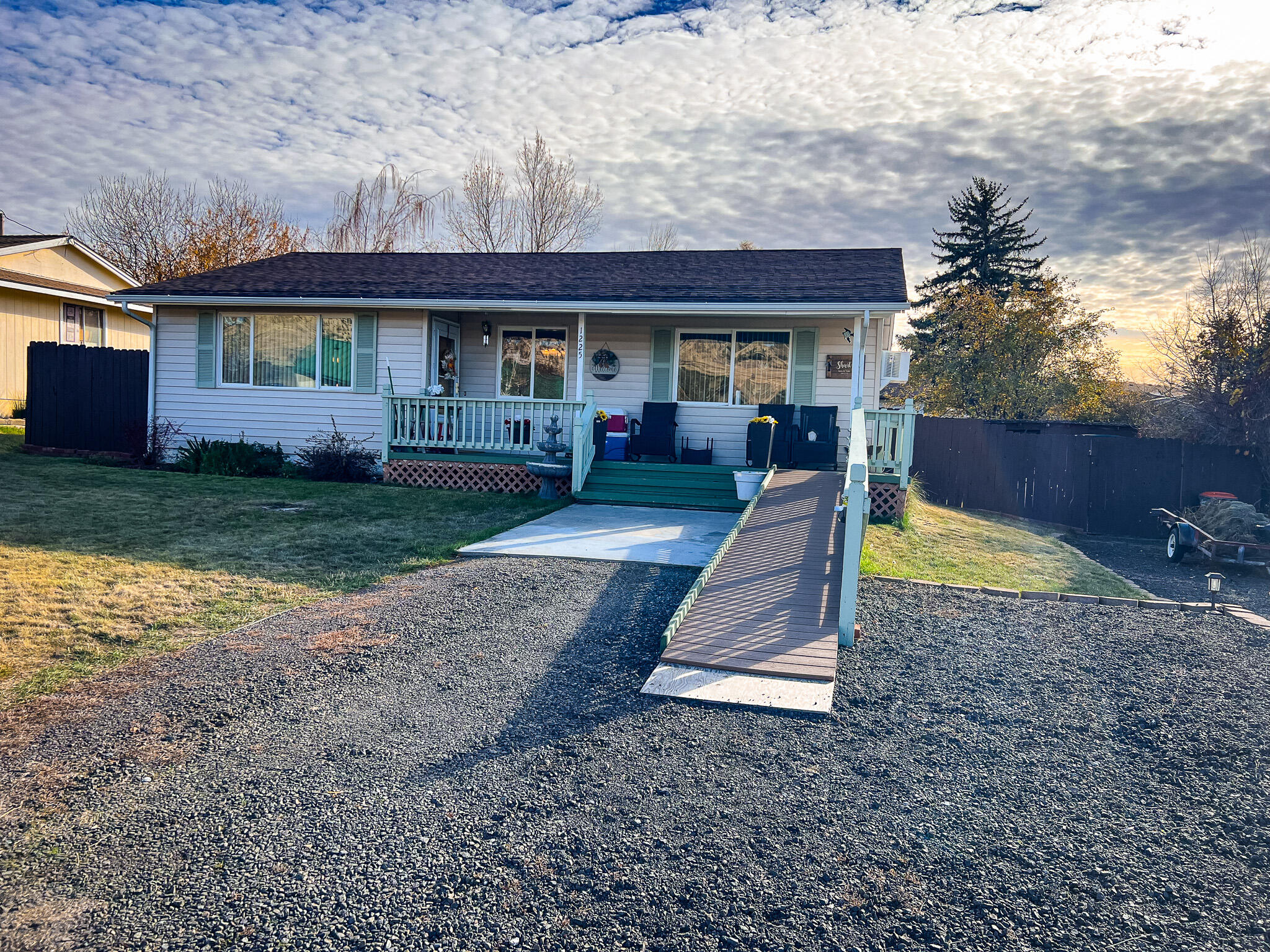 1225 East B Street Fossil, OR 97830 - Photo 31 of 33 a view of a house with a yard patio and a fire pit