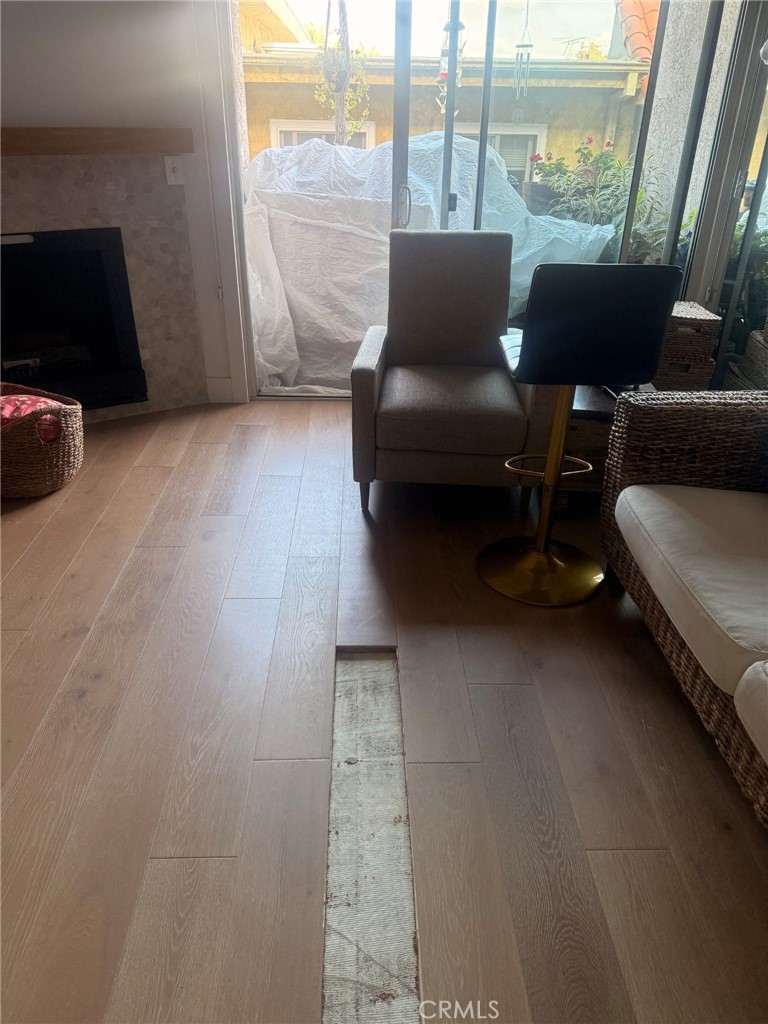 8740 Tuscany Avenue, Unit 211 Playa del Rey, CA 90293 - Photo 23 of 24 a living room with furniture and a floor to ceiling window