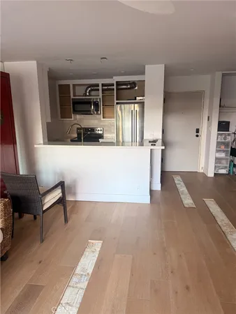 a view of kitchen with furniture and wooden floor