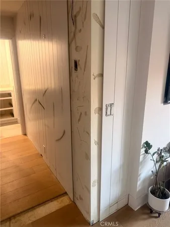 a view of a bathroom from a corridor