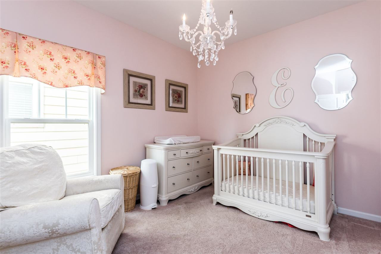 1413 Van Page Boulevard Raleigh, NC 27607 - Photo 16 of 25 SECOND SPACIOUS BEDROOM UPSTAIRS---CHANDELIER DOES NOT CONVEY. BEDROOM