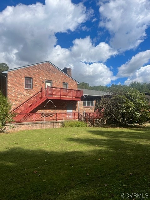 5711 Thweatt Drive Disputanta, VA 23842 - Photo 16 of 19 a front view of a house with a garden