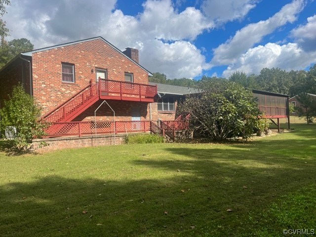 5711 Thweatt Drive Disputanta, VA 23842 - Photo 17 of 19 a front view of house with yard and trees in the background