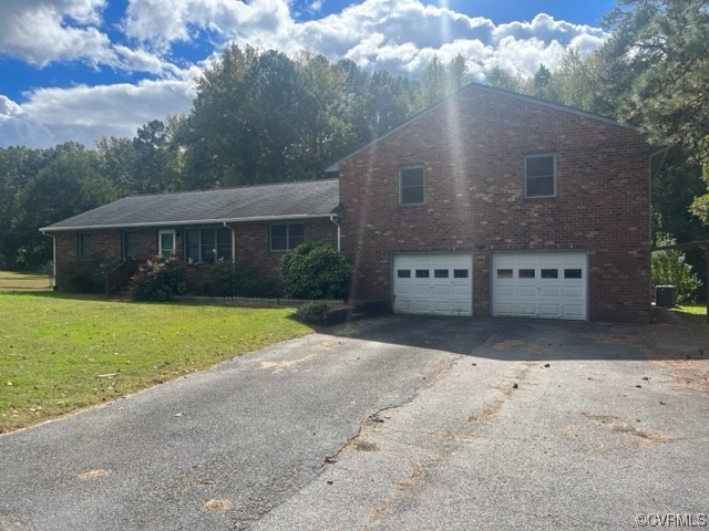 5711 Thweatt Drive Disputanta, VA 23842 - Photo 18 of 19 a view of a house with a yard
