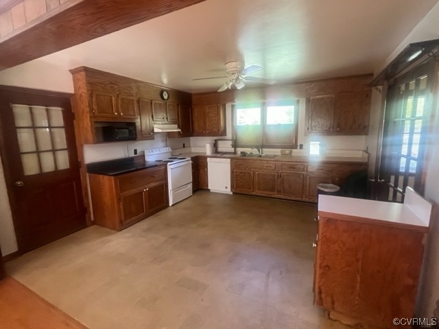 5711 Thweatt Drive Disputanta, VA 23842 - Photo 5 of 19 a large kitchen with a large counter top space a sink stainless steel appliances and cabinets