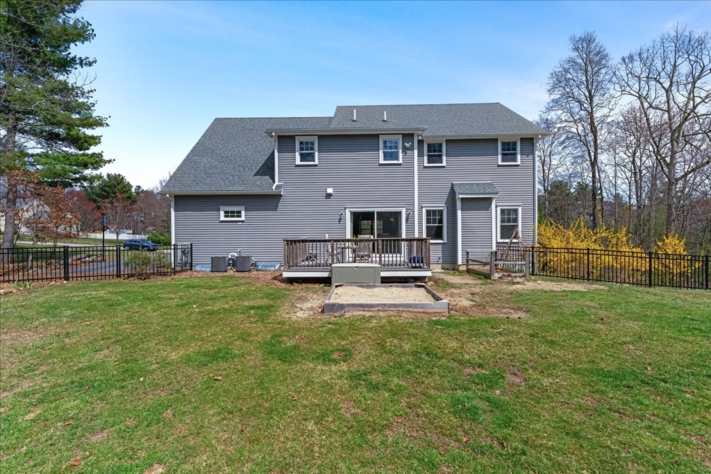 50 Quabbin Path Sutton, MA 01590 - Photo 39 of 42 a view of a house with a yard patio and fire pit