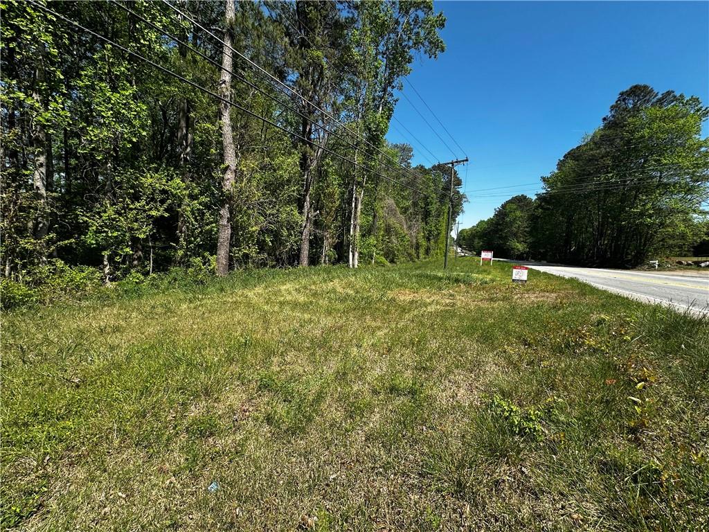 0 Hiram Sudie Road Hiram, GA 30141 - Photo 14 of 20 a big yard with lots of green space and house in the back