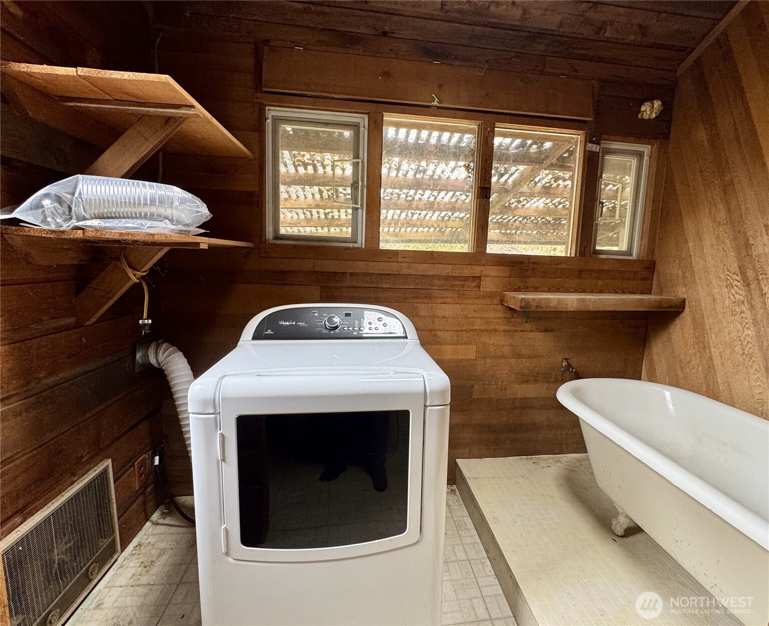 7513 Robe Menzel Road Granite Falls, WA 98252 - Photo 11 of 31 a living room with furniture a flat screen tv and a fireplace