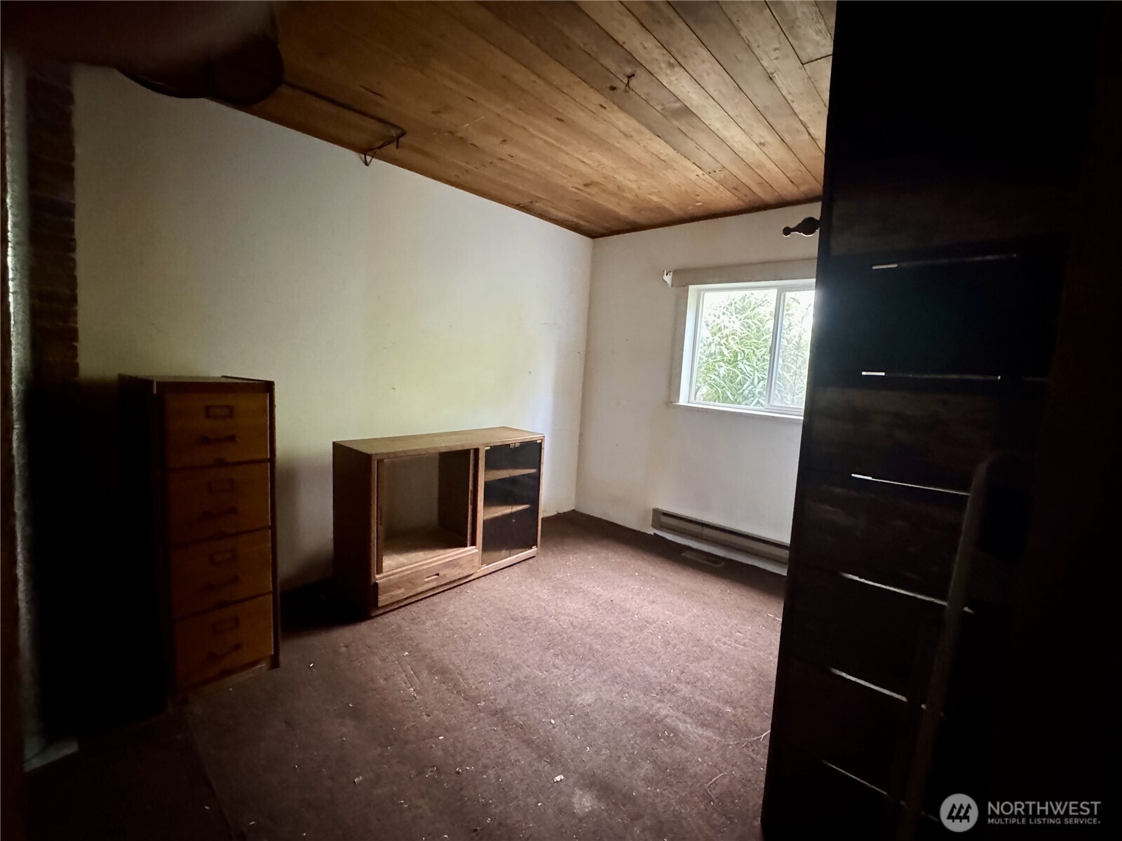 7513 Robe Menzel Road Granite Falls, WA 98252 - Photo 13 of 31 a view of an empty room with a fireplace and a window