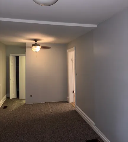 an empty room with a mirror