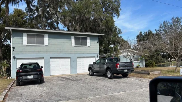 a view of a car parked in front of a house