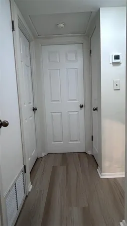 a view of room with hardwood floor