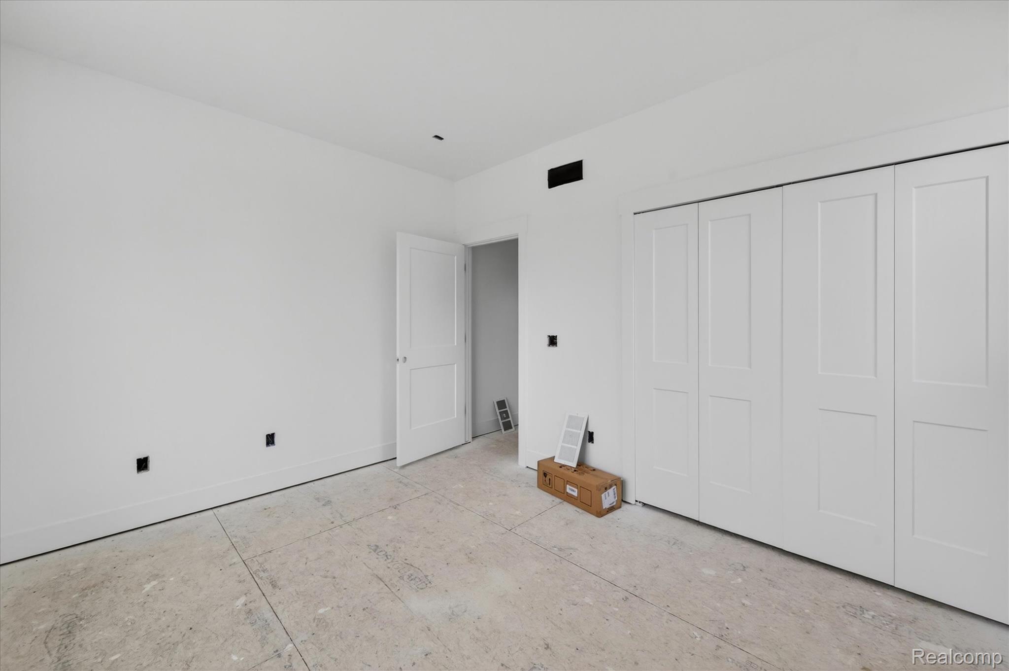 3297 Oak Grove Road Howell, MI 48855 - Photo 9 of 40 Spacious secondary bedroom with generous closet space and natural light.