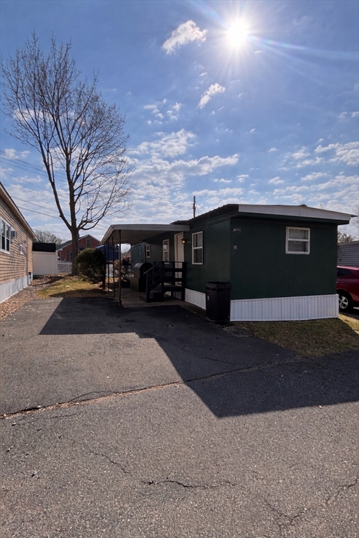 229 Miller Street, Unit 3G Ludlow, MA 01056 - Photo 1 of 15 a front view of a house with a yard