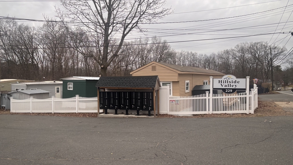 229 Miller Street, Unit 3G Ludlow, MA 01056 - Photo 11 of 15 a front view of a house with a garage