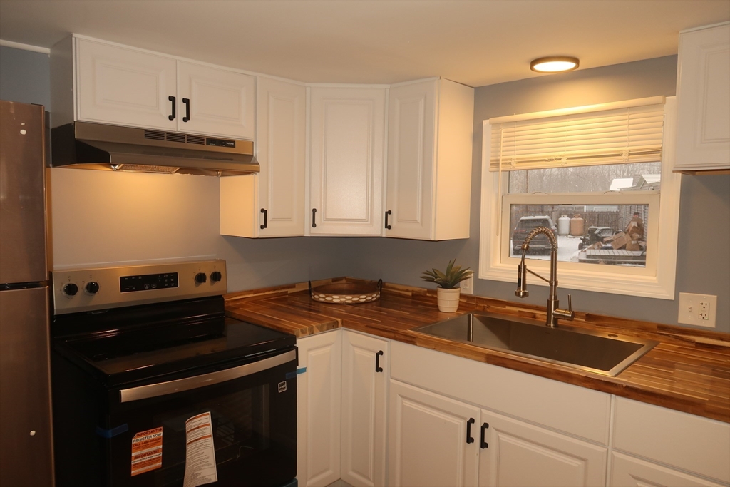 229 Miller Street, Unit 3G Ludlow, MA 01056 - Photo 3 of 15 a kitchen with a sink and cabinets