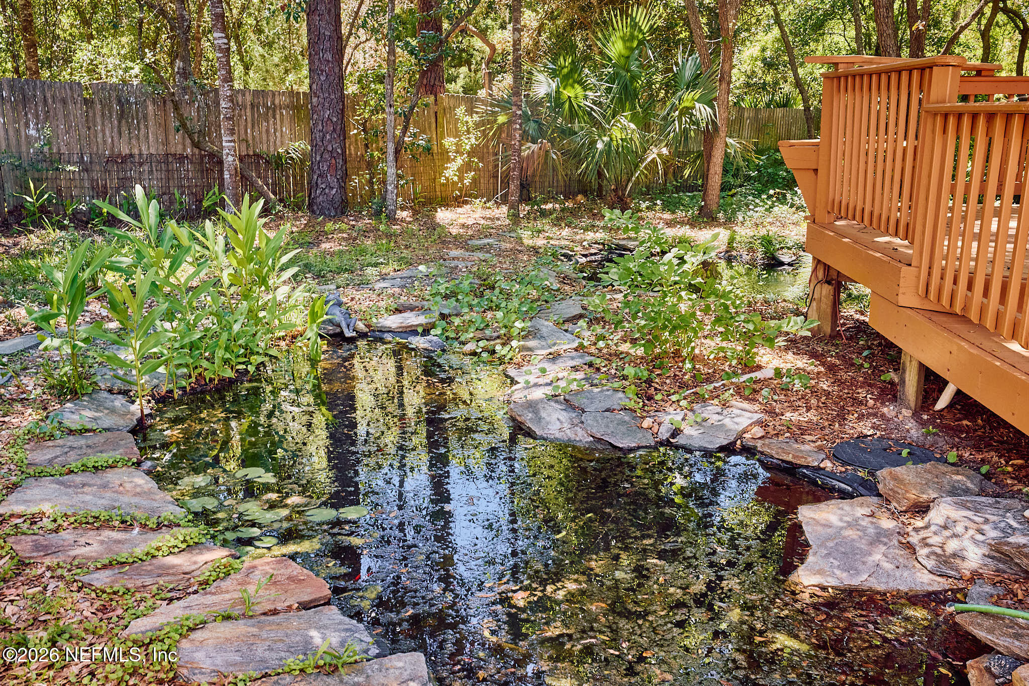 85404 Burmeister Road Fernandina Beach, FL 32034 - Photo 12 of 53 a backyard of a house with lots of green space