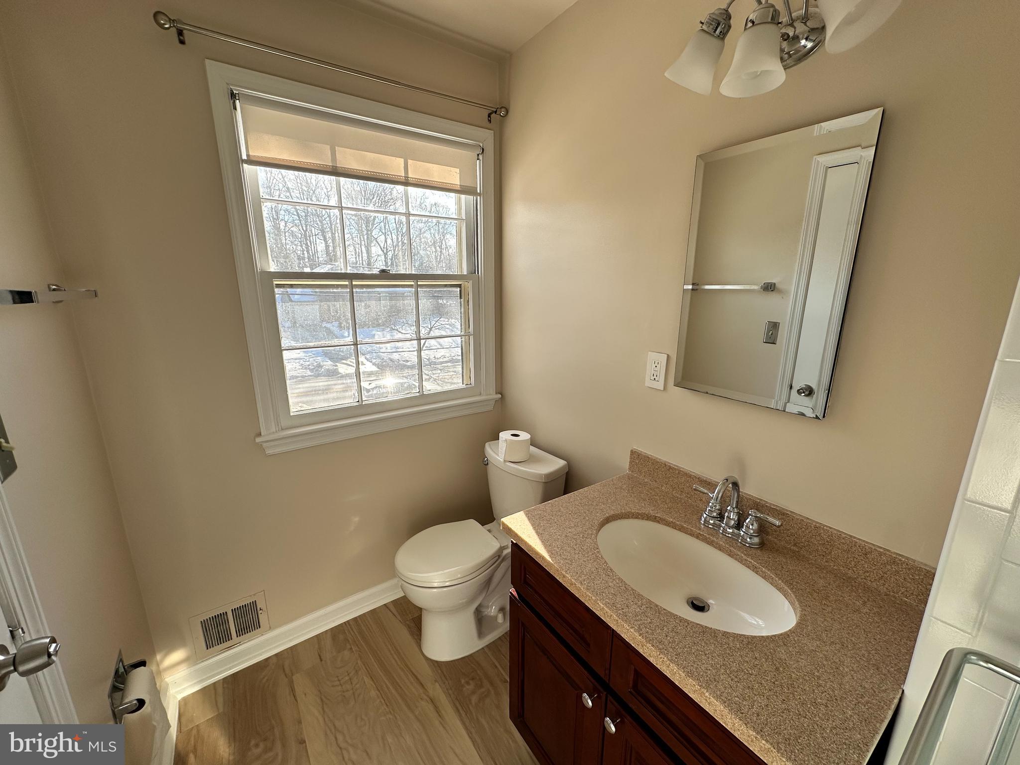 4405 Bel Pre Road Rockville, MD 20853 - Photo 13 of 24 a bathroom with a sink and a mirror