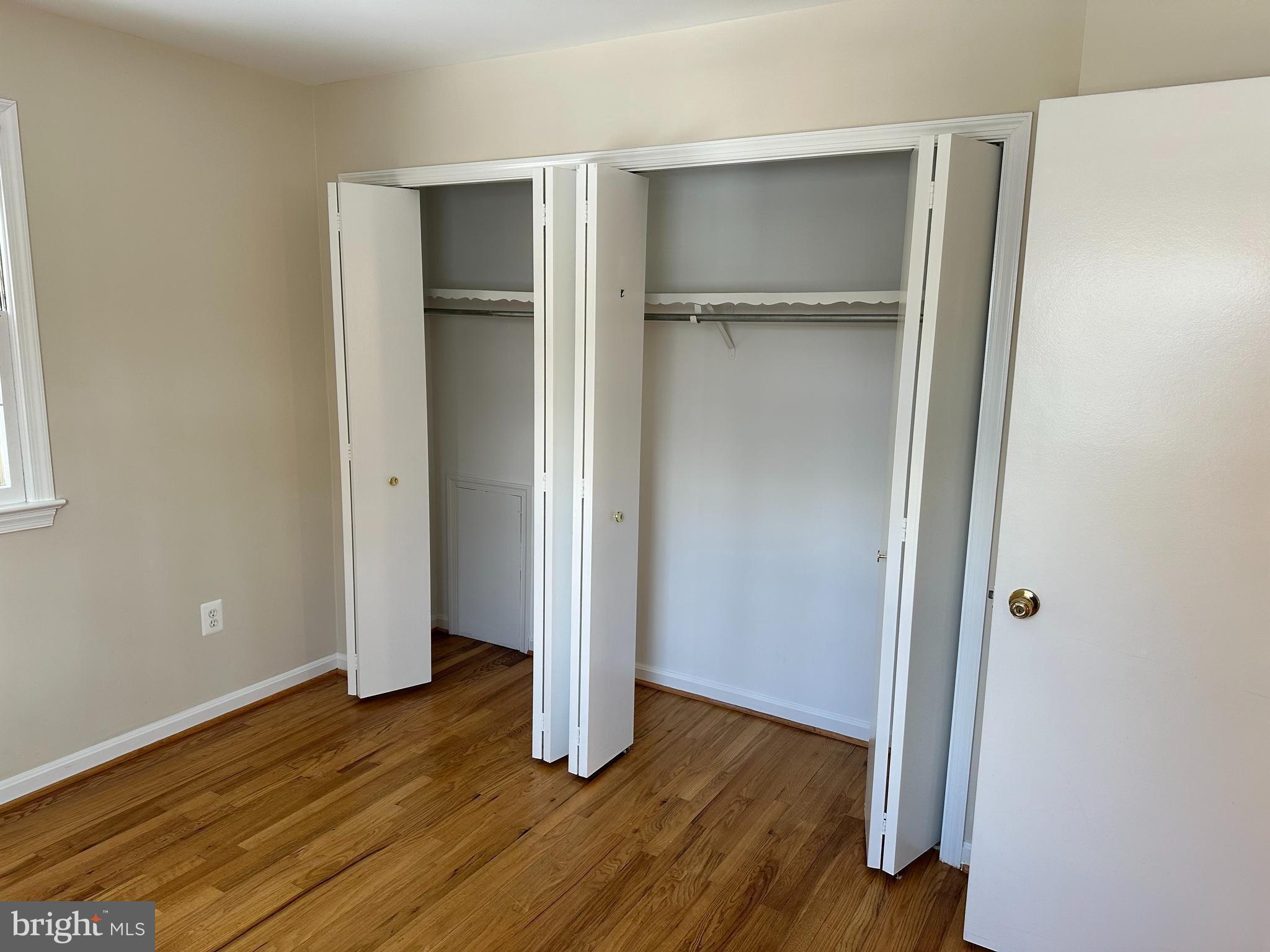 4405 Bel Pre Road Rockville, MD 20853 - Photo 16 of 24 a view of an empty room with wooden floor and closet