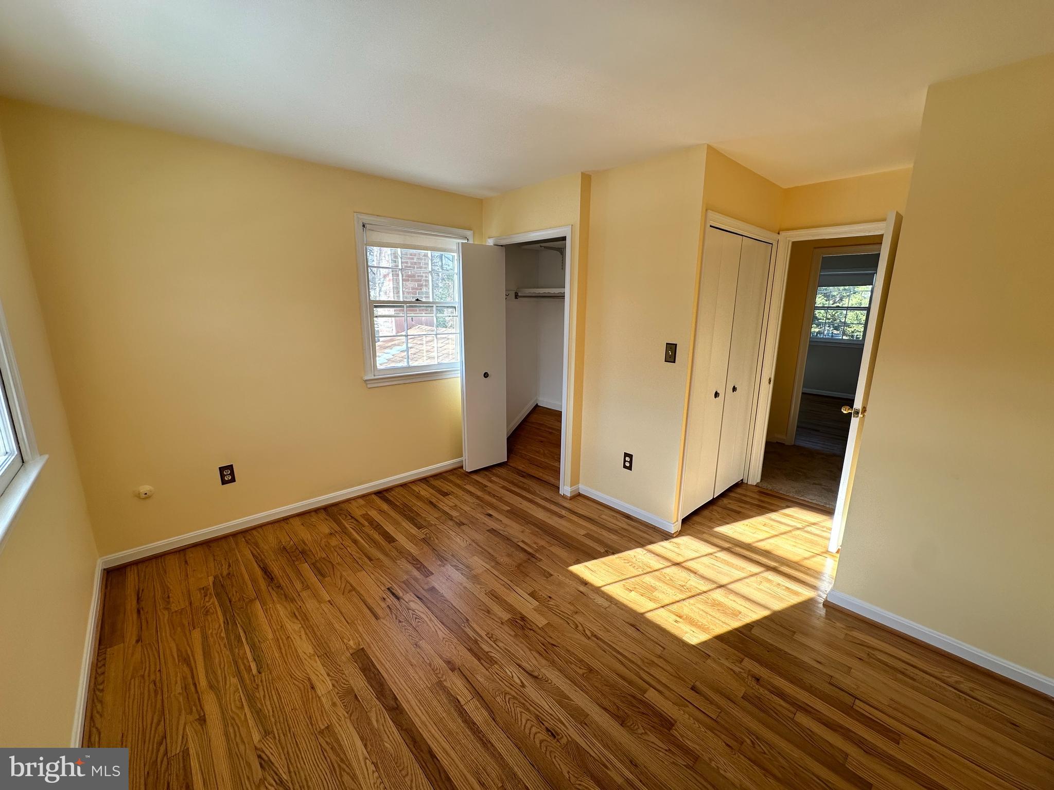 4405 Bel Pre Road Rockville, MD 20853 - Photo 17 of 24 a view of an empty room with wooden floor and a window
