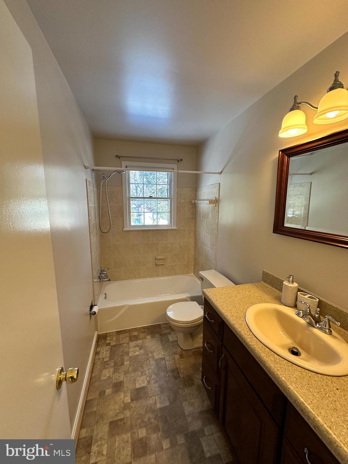 4405 Bel Pre Road Rockville, MD 20853 - Photo 19 of 24 a bathroom with a granite countertop sink toilet and shower