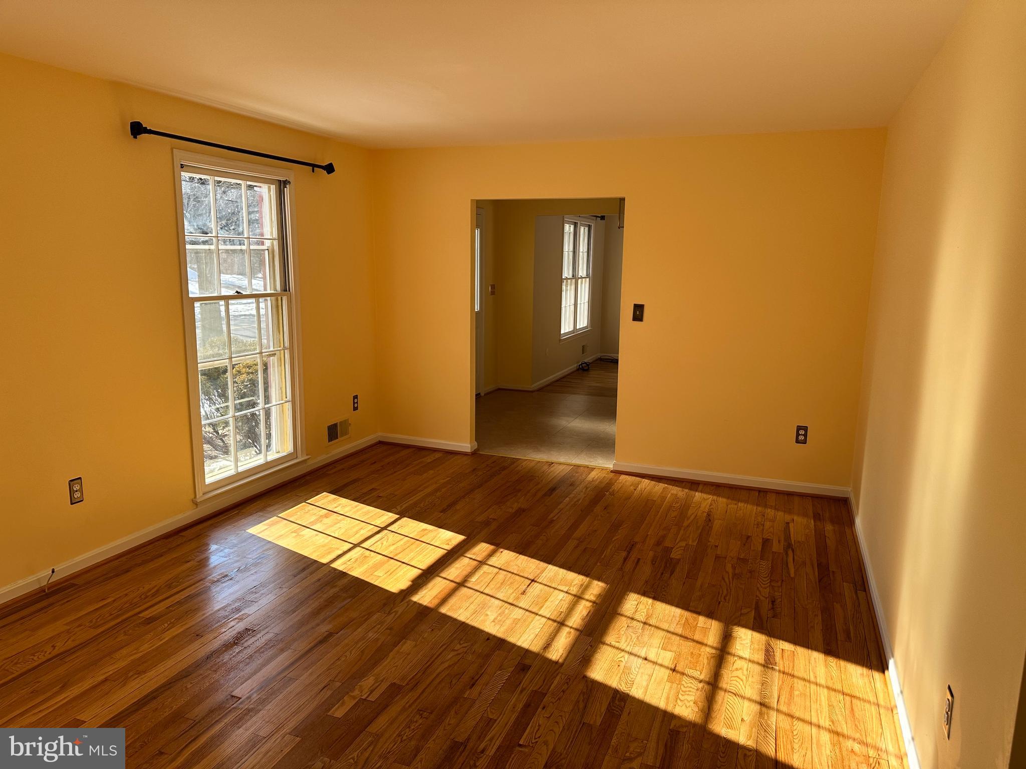 4405 Bel Pre Road Rockville, MD 20853 - Photo 2 of 24 a view of a room with wooden floor and windows