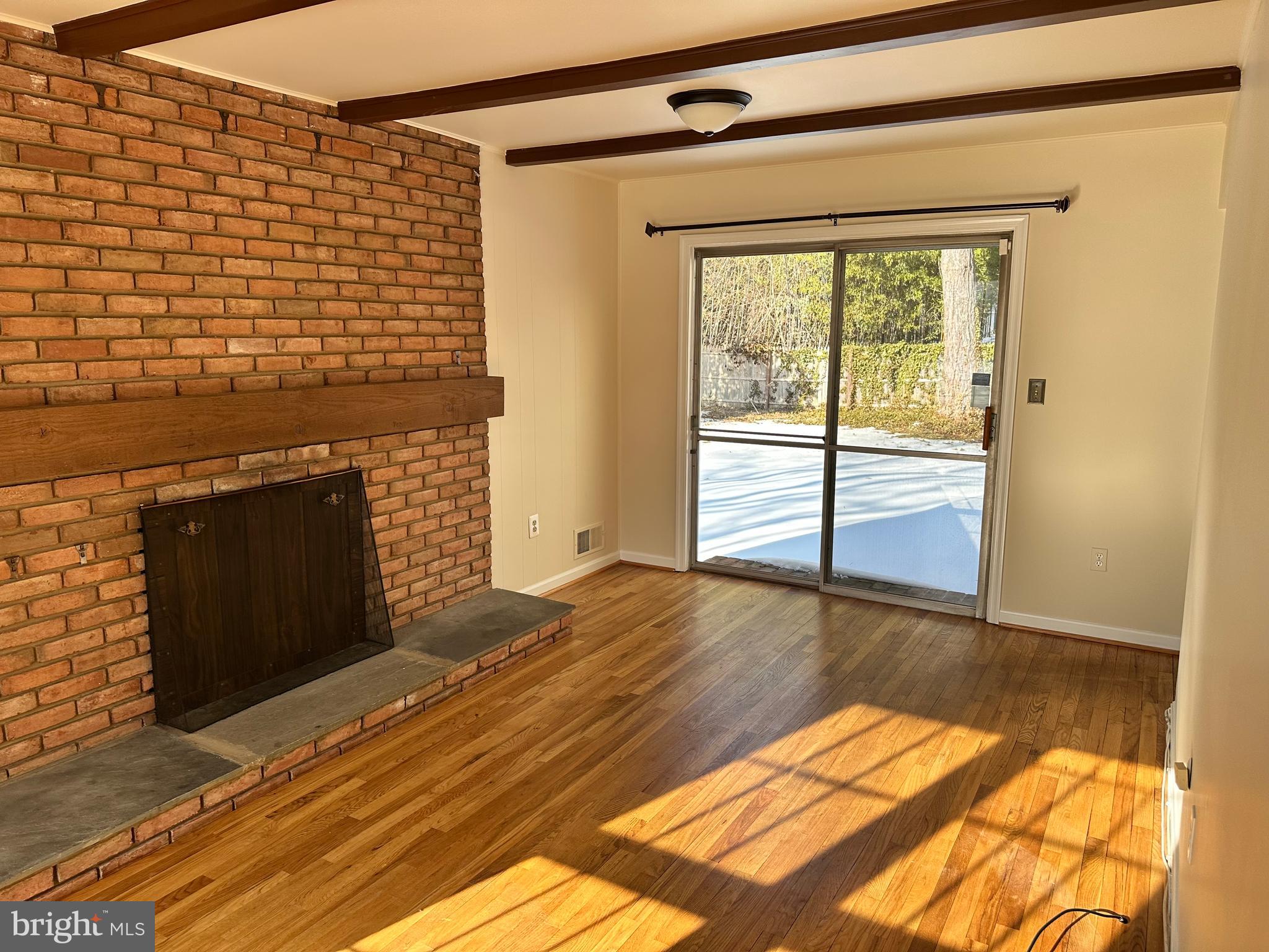 4405 Bel Pre Road Rockville, MD 20853 - Photo 5 of 24 a view of empty room with wooden floor and fan