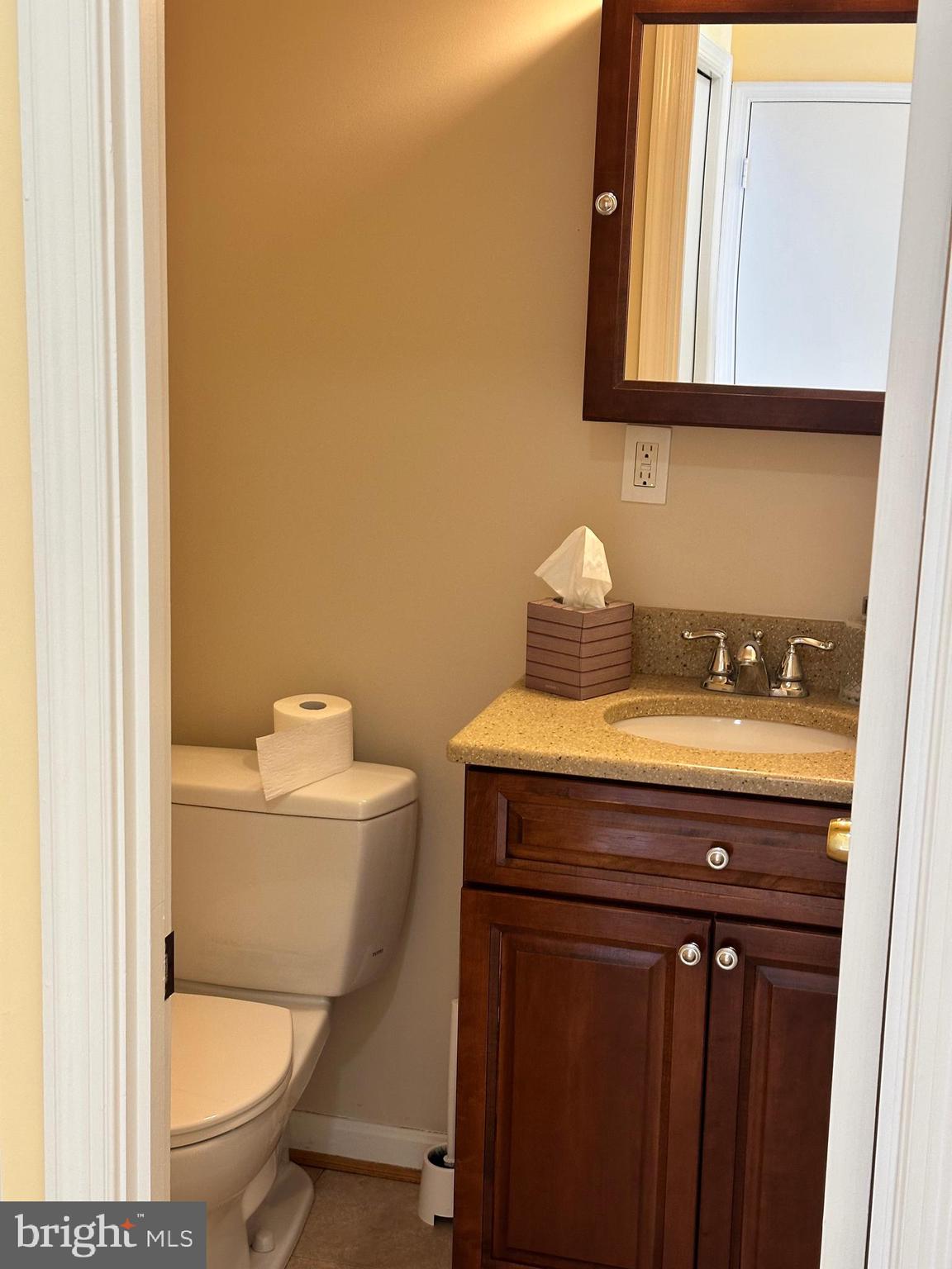 4405 Bel Pre Road Rockville, MD 20853 - Photo 9 of 24 a bathroom with a granite countertop toilet and a sink