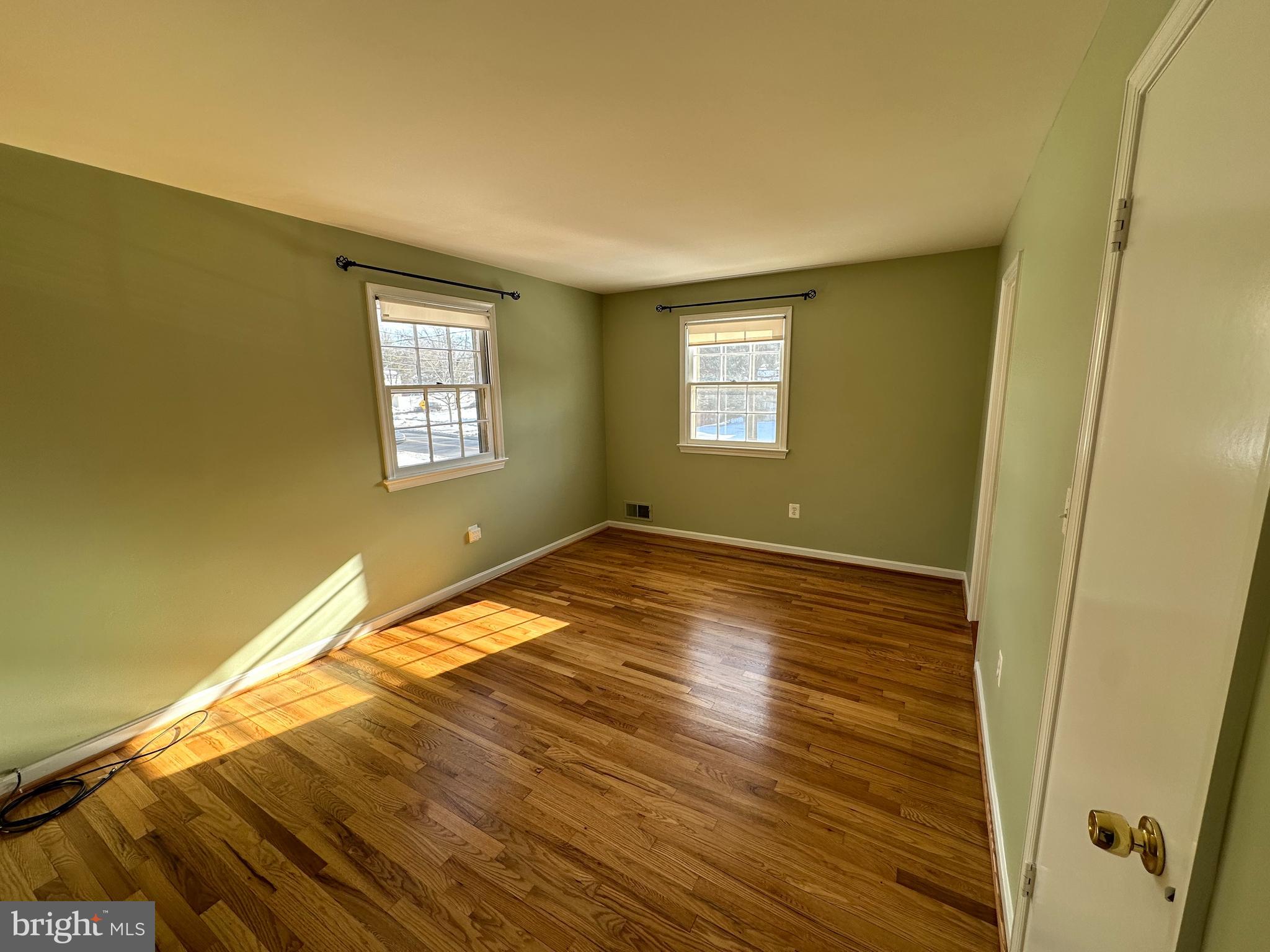 4405 Bel Pre Road Rockville, MD 20853 - Photo 10 of 24 a view of empty room with wooden floor and fan