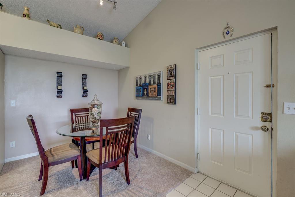 13545 Eagle Ridge Drive, Unit 827 Fort Myers, FL 33912 - Photo 20 of 27 a view of a dining room with furniture
