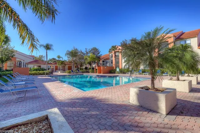 a view of a swimming pool with a patio