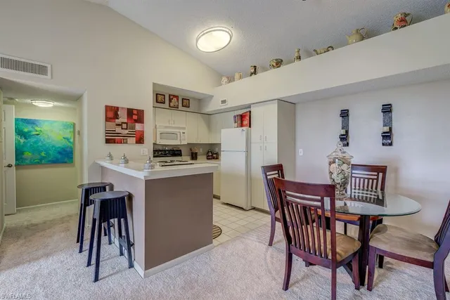 a view of kitchen with furniture and wooden floor