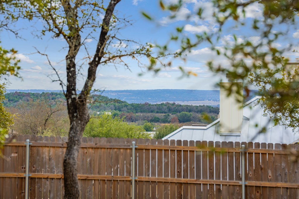 2330 Summit Forest, Unit 280R Fredericksburg, TX 78624 - Photo 6 of 10 a view of a street with a tree in the background