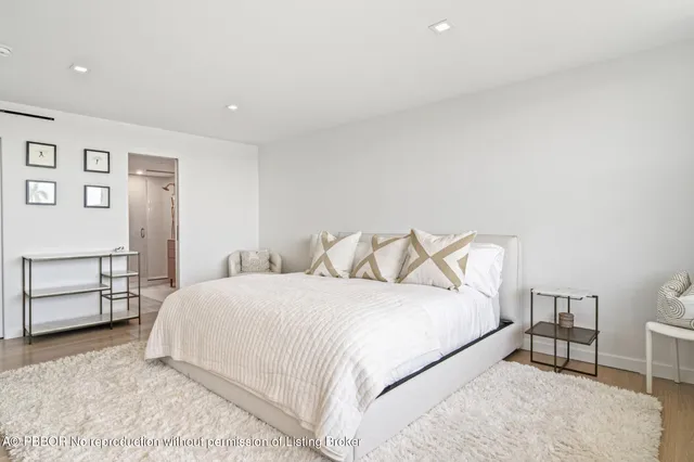 a bedroom with a bed and chair