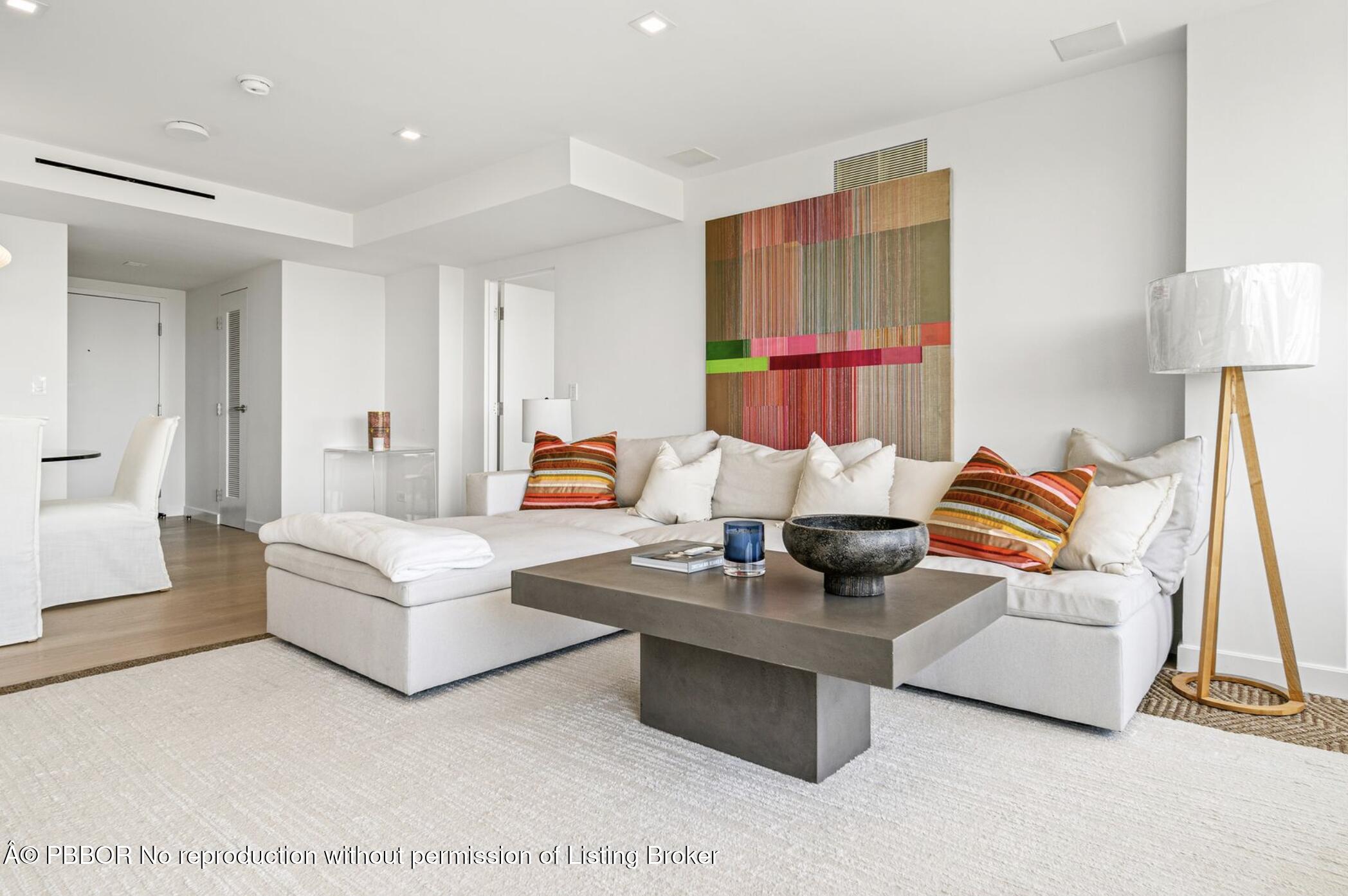 333 Sunset Avenue, Unit 308 Palm Beach, FL 33480 - Photo 8 of 21 a living room with furniture a rug and a lamp