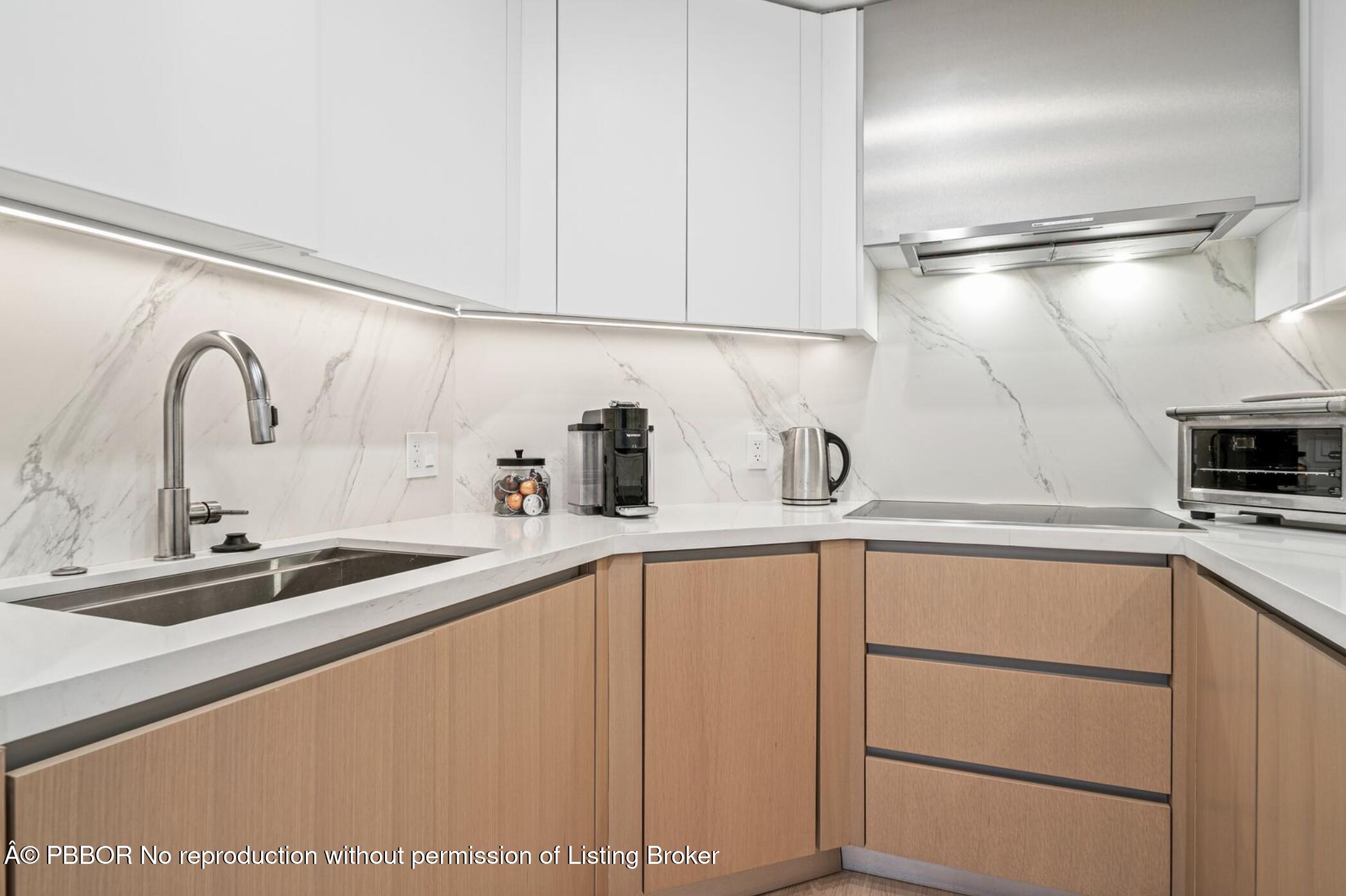 333 Sunset Avenue, Unit 308 Palm Beach, FL 33480 - Photo 10 of 21 a kitchen with a sink and cabinets