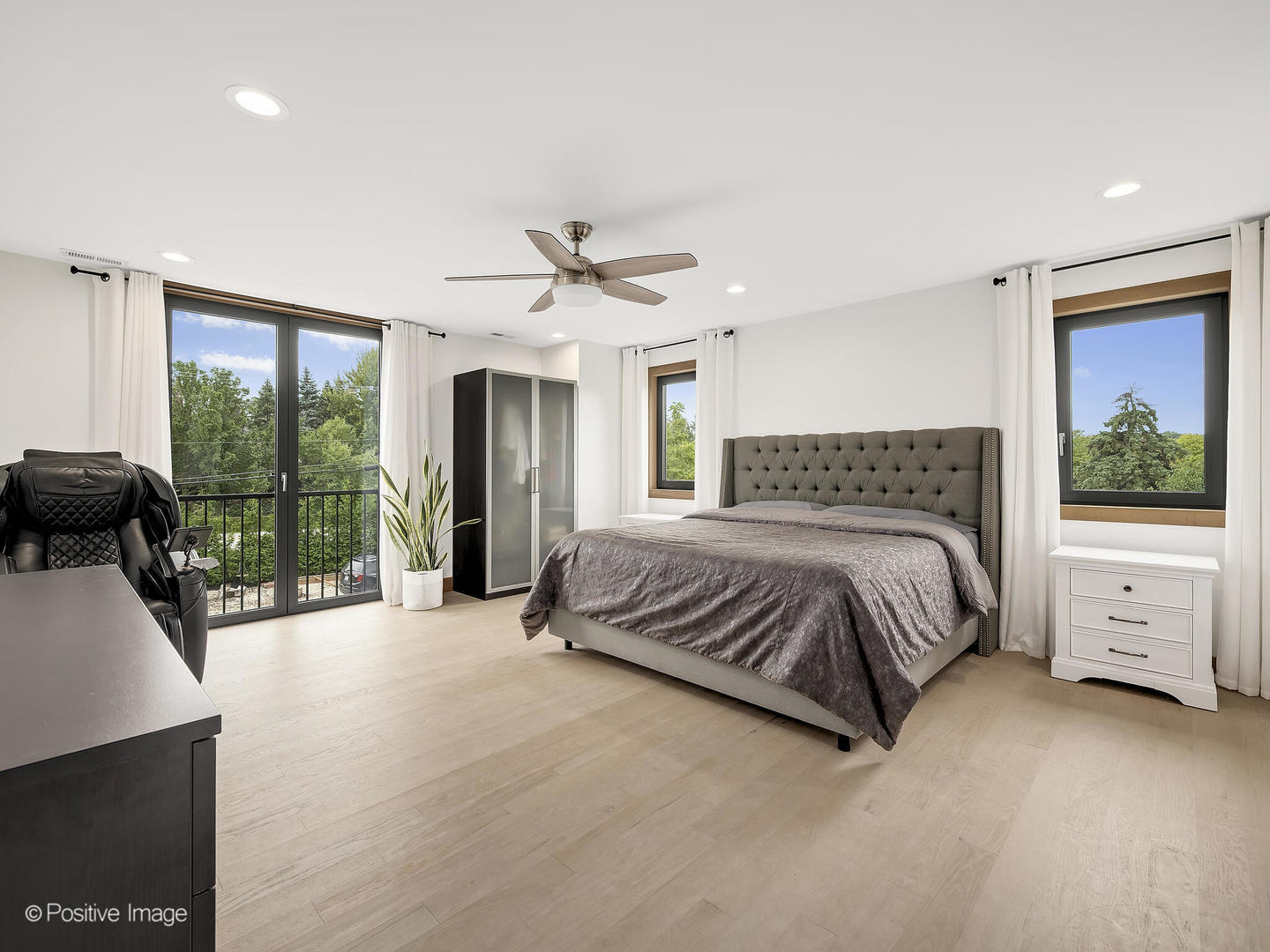 11670 79th Street Burr Ridge, IL 60527 - Photo 16 of 31 a spacious bedroom with a large bed and a large window