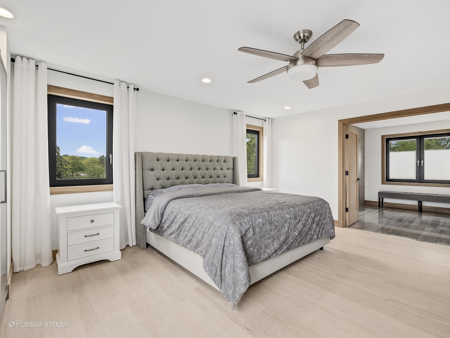 11670 79th Street Burr Ridge, IL 60527 - Photo 17 of 31 a bedroom with a large bed and a window