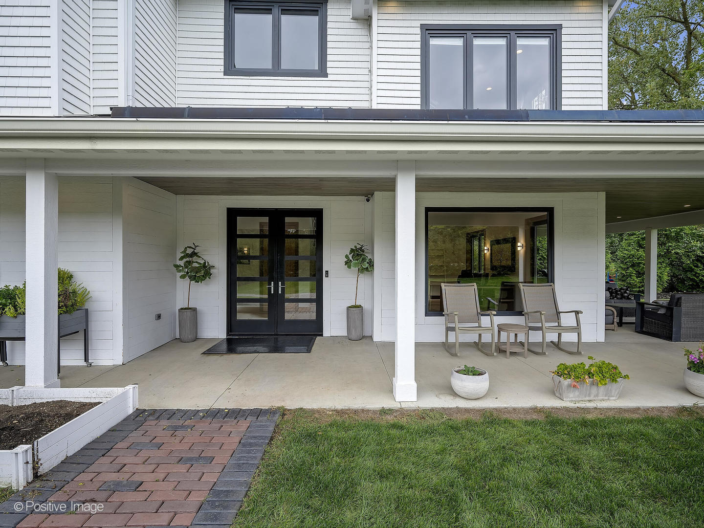 11670 79th Street Burr Ridge, IL 60527 - Photo 2 of 31 a front view of a house with porch and garden