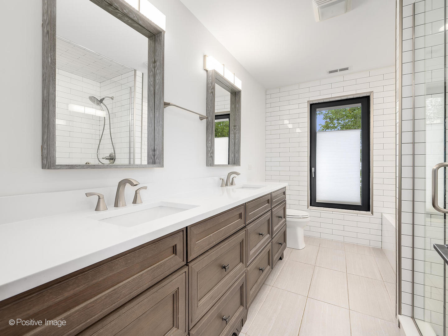 11670 79th Street Burr Ridge, IL 60527 - Photo 22 of 31 a bathroom with a double vanity sink a mirror and a